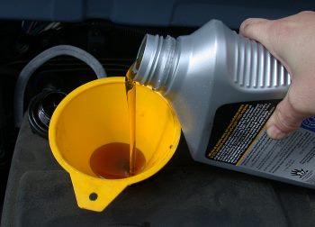 pouring engine oil