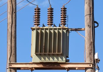 a high voltage power transformer on a post
